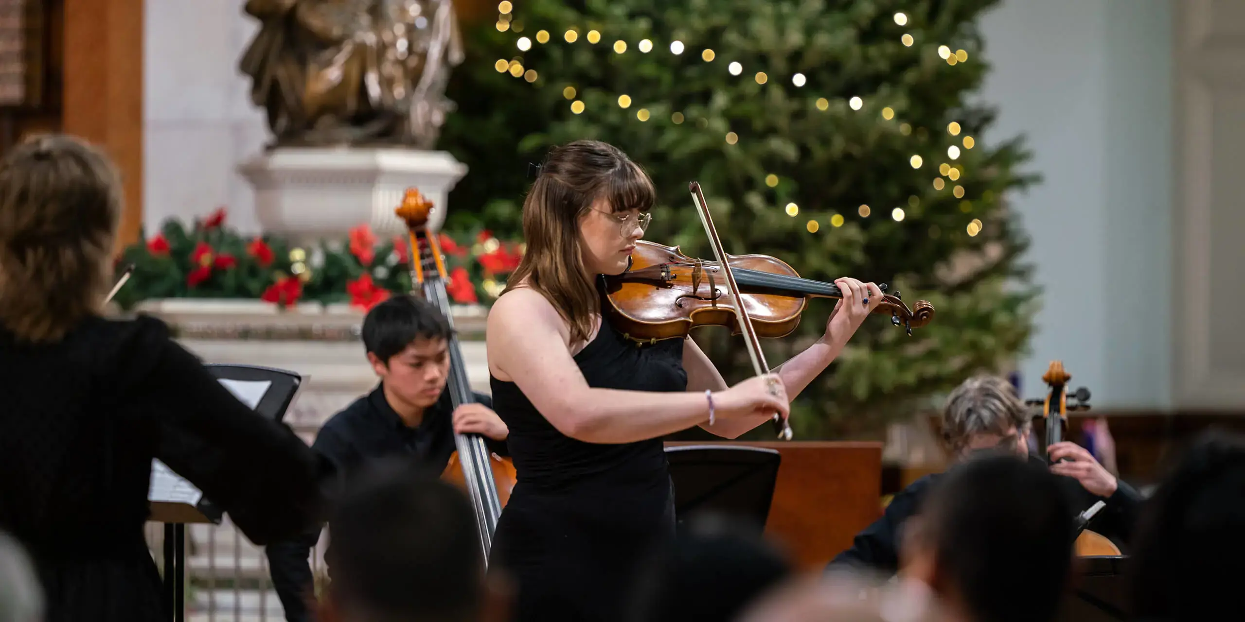 St. Mary's Music School violin pupil performing at a Christmas concert