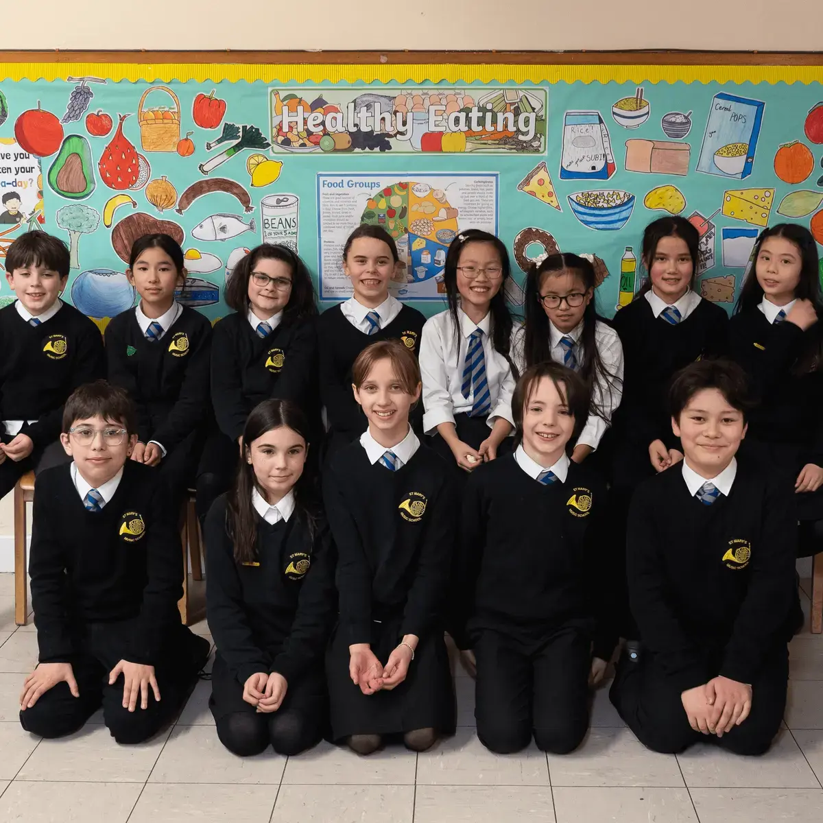 Pupils with healthy eating board